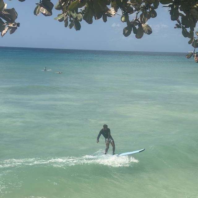 Surfer catching a small wave