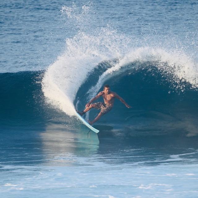 Surfer riding a barrel